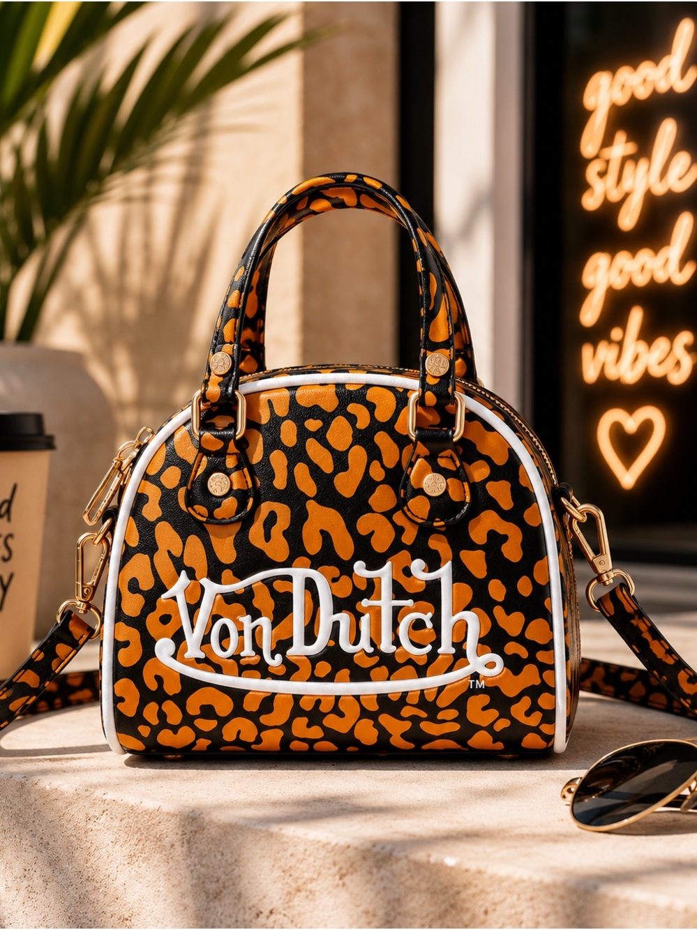 Von Dutch Cheetah Orange Bowling Bag Crossbody Handbag
Satchel